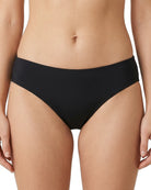 black calvin klein bikini bottom worn by a person on a white background