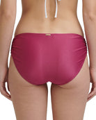 rose calvin klein bikini bottom worn by a person on a white background