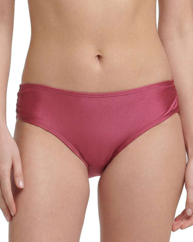 rose calvin klein bikini bottom worn by a person on a white background