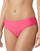 Pink calvin klein bikini bottom worn by a person on a white background
