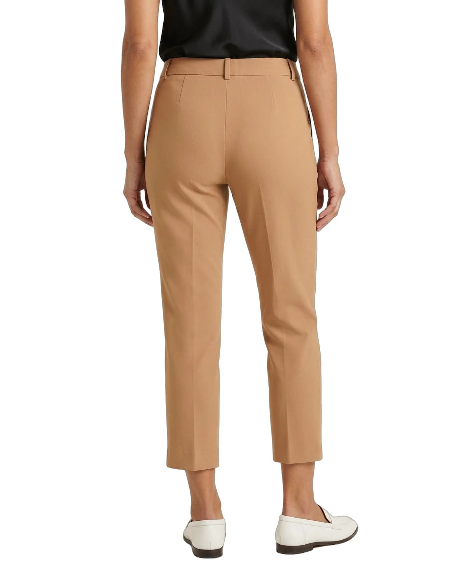 Tan Calvin Klein pants worn by a person on a white background