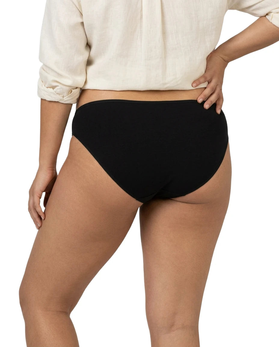 Person wearing black high-waisted underwear on a white background