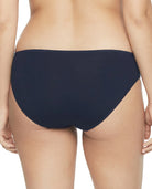 Navy blue bikini bottom worn by a person on a white background