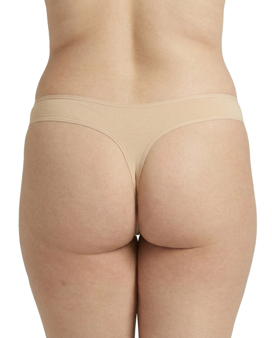 Beige underwear worn by a person on a white background