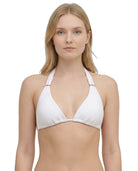 Woman wearing a white bikini Calvin Klein top on a white background