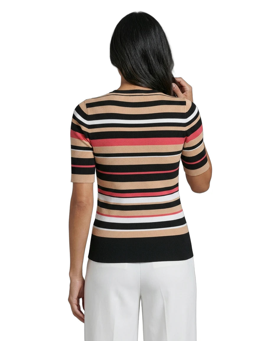 Woman wearing a Calvin Klein striped sweater with a white background