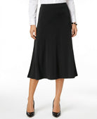 Woman wearing a black skirt with a white shirt on a white background