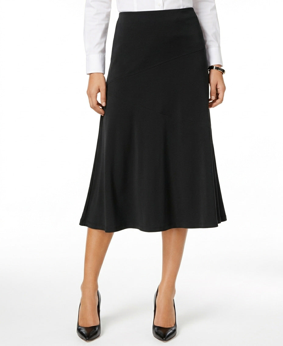 Woman wearing a black skirt with a white shirt on a white background