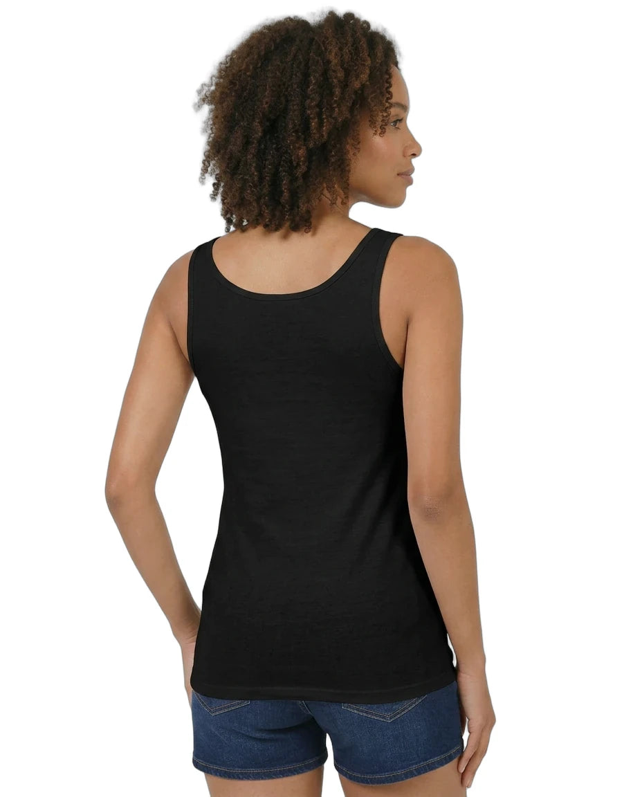 Woman wearing a black tank top and blue shorts on a white background