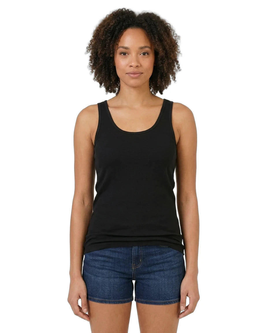 Woman wearing a black tank top and blue shorts on a white background