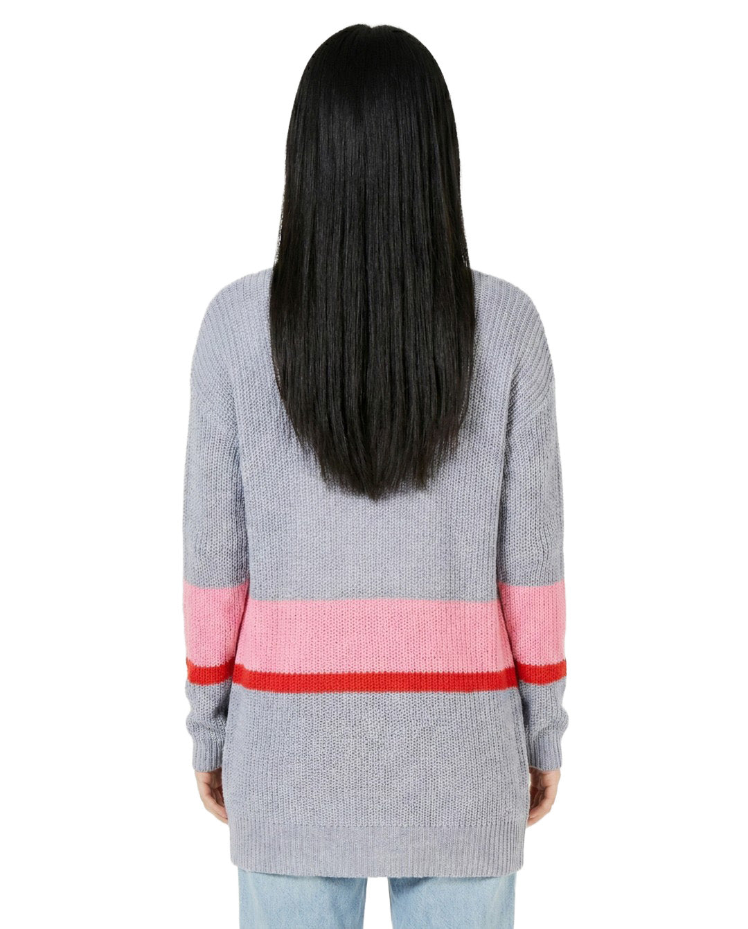 Person wearing a gray sweater with pink and red stripes on a white background